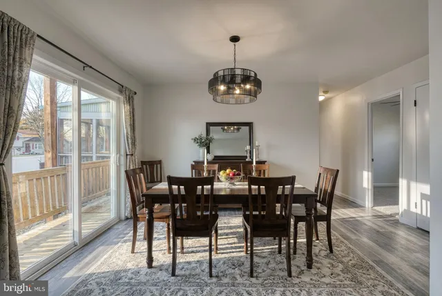 a kitchen with stainless steel appliances granite countertop a refrigerator a stove a sink dishwasher a microwave oven with cabinets and wooden floor