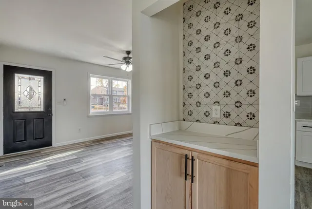 a kitchen with a sink stainless steel appliances and cabinets