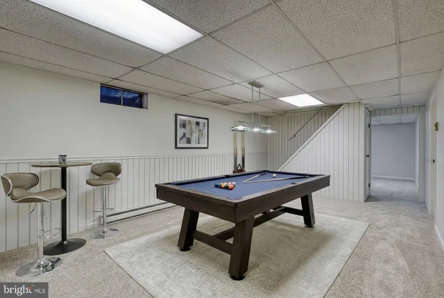 a view of a backyard with a garden and deck