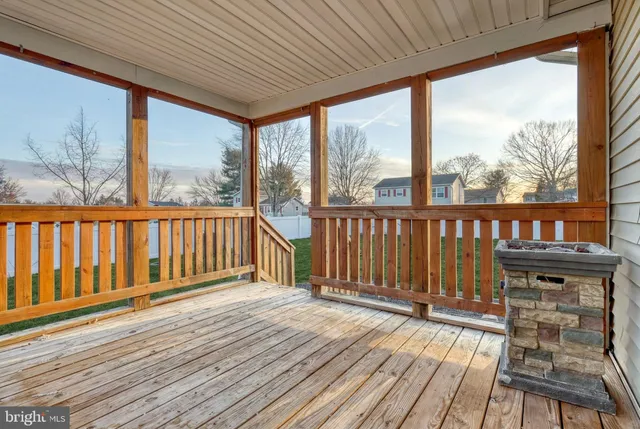 an aerial view of a house with a garden and lake view