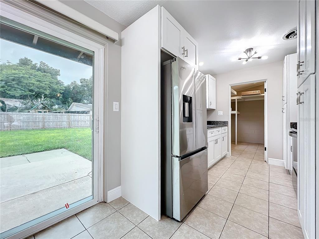 600 Ridgefield Avenue Ocoee, FL 34761 - Photo 25 of 45 Stainless steel appliances in your newly renovated kitchen with new cabinets and solid granite countertops.