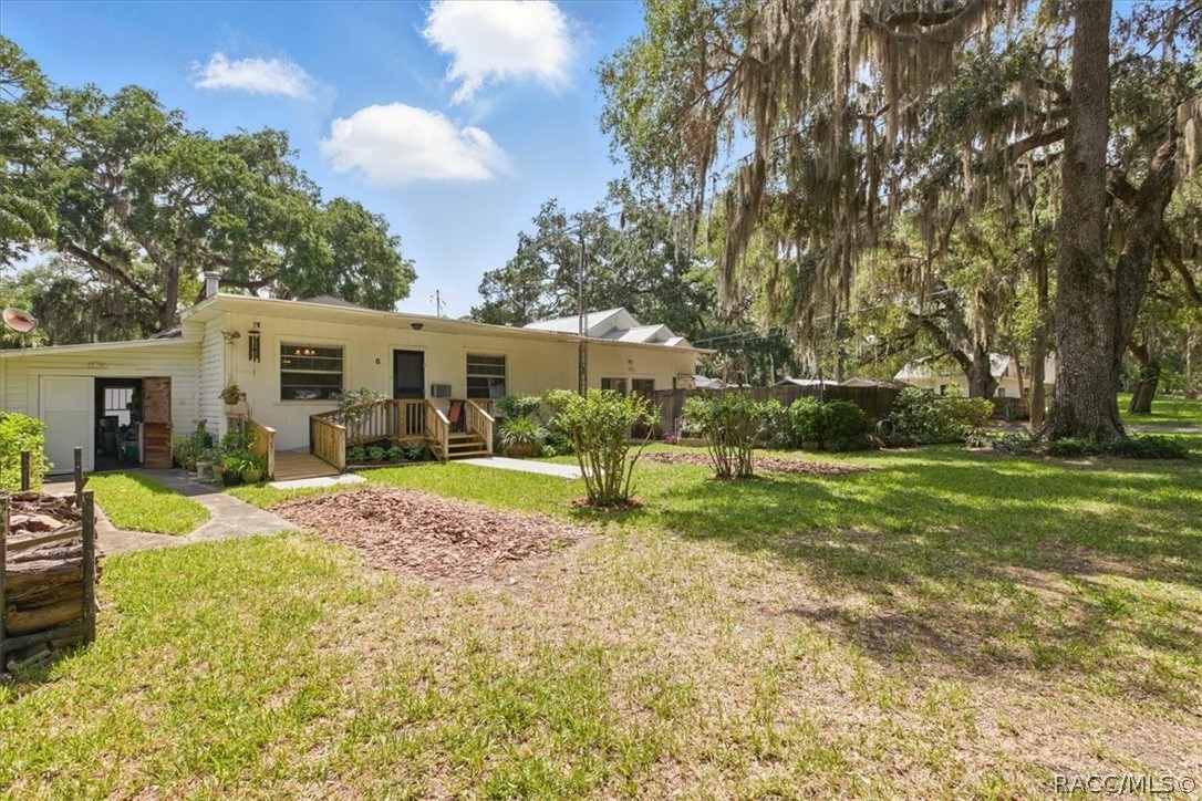 6 62nd Street Yankeetown, FL 34498 - Photo 4 of 55 a view of a house with a yard porch and sitting area