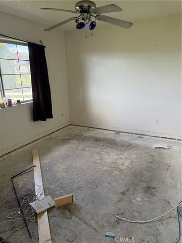 a view of a room with rack and hardwood floor