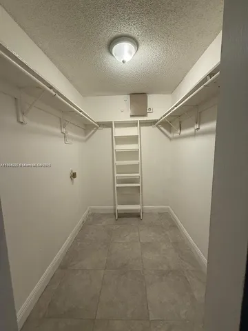a view of an empty walk in closet