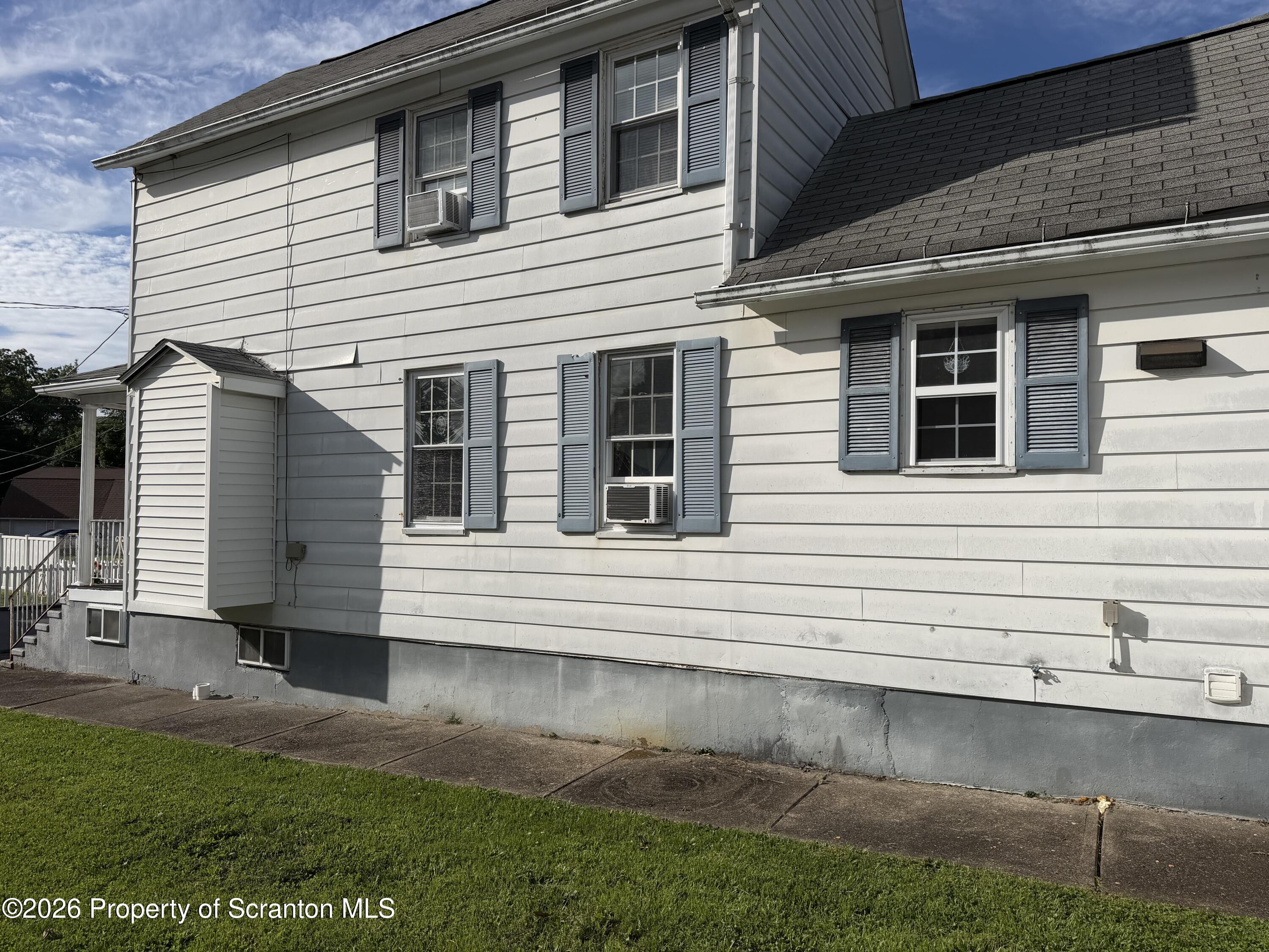 320 Haverly Street Throop, PA 18512 - Photo 3 of 27 a view of a house with a yard
