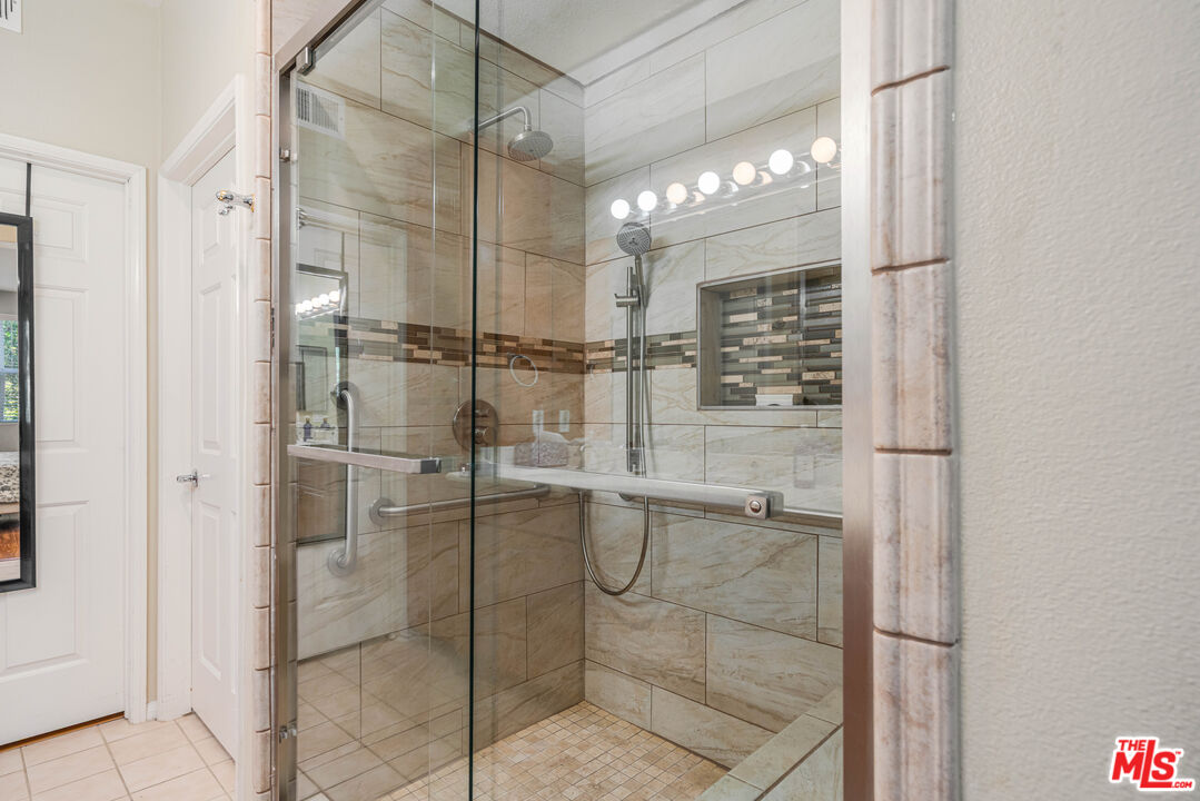 12963 West Runway Road, Unit 221 Playa Vista, CA 90094 - Photo 13 of 17 a bathroom with a glass shower door