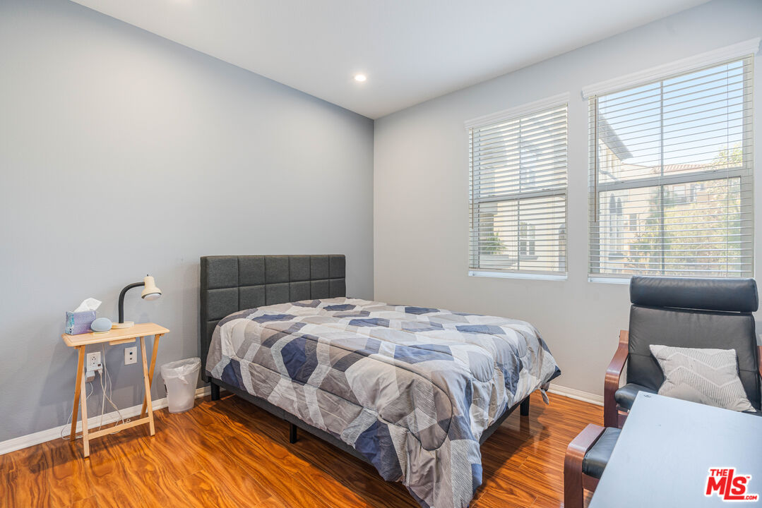12963 West Runway Road, Unit 221 Playa Vista, CA 90094 - Photo 15 of 17 a bedroom with a bed and wooden floor