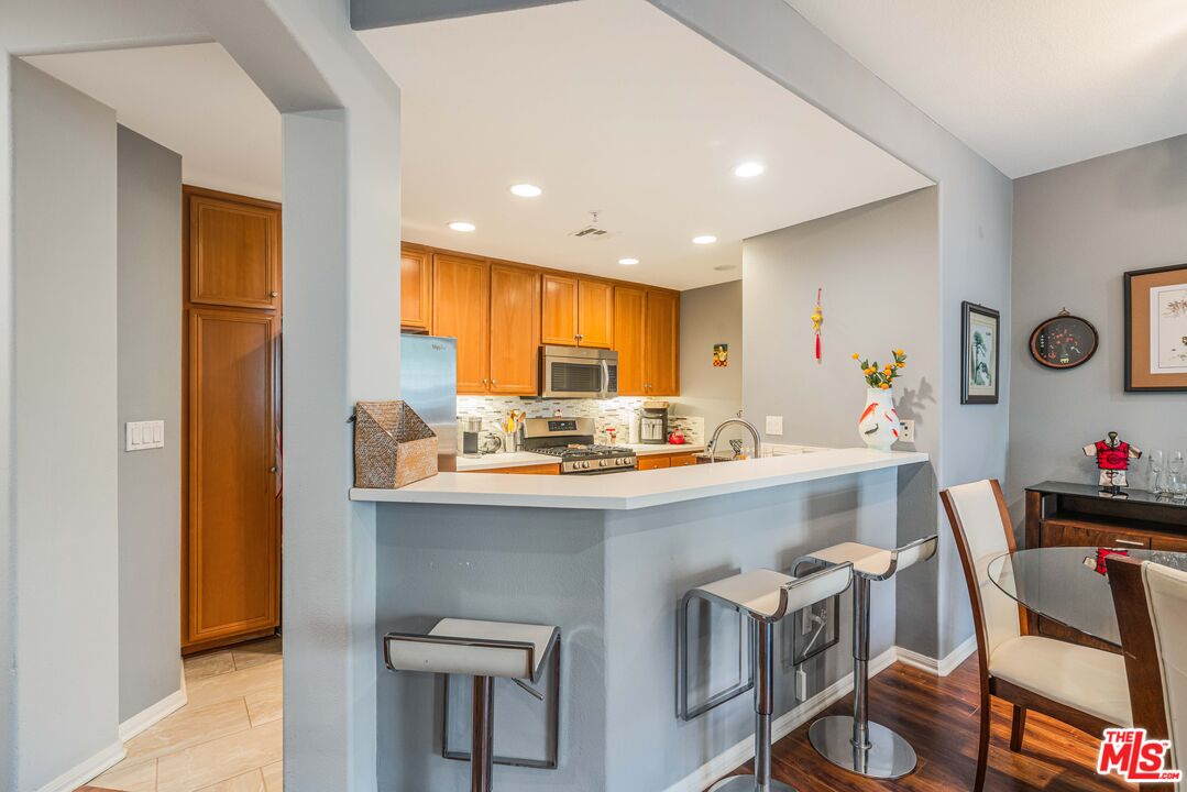 12963 West Runway Road, Unit 221 Playa Vista, CA 90094 - Photo 4 of 17 a kitchen with a sink cabinets and window