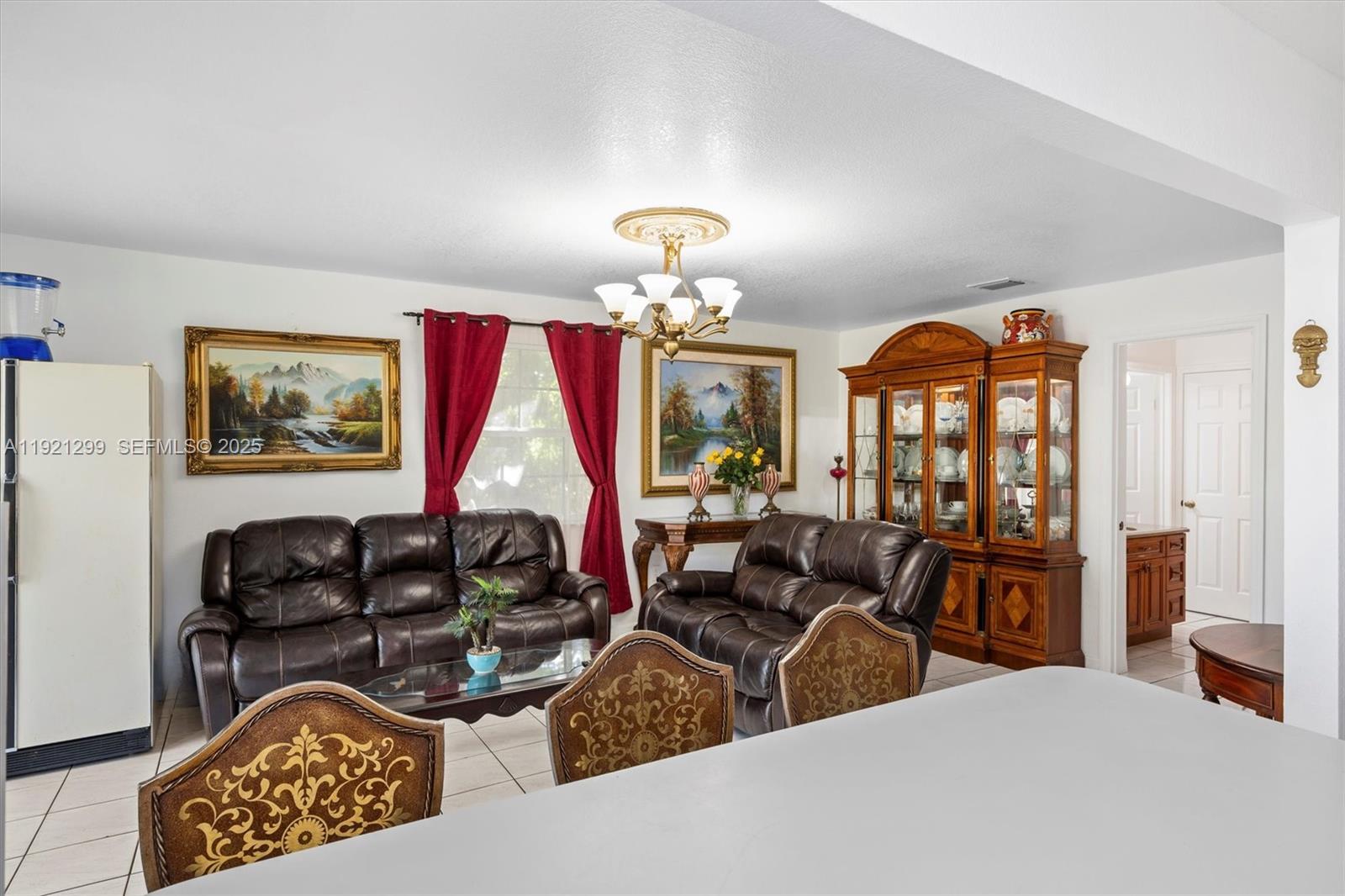 20851 Southwest 242nd Street Homestead, FL 33031 - Photo 13 of 42 a living room with furniture flowerpot and window