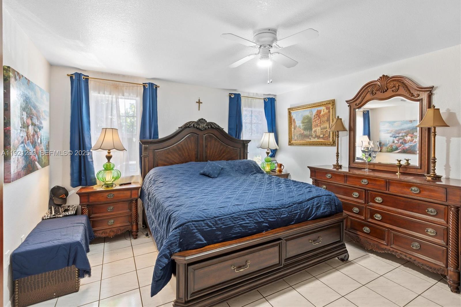 20851 Southwest 242nd Street Homestead, FL 33031 - Photo 17 of 42 a bedroom with a bed and wooden floor