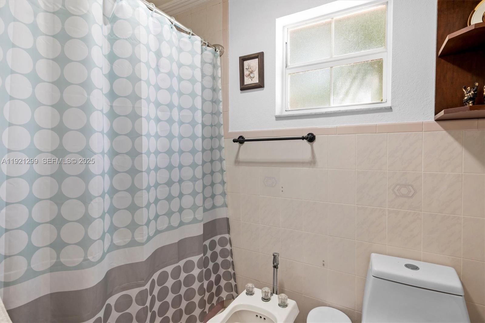 20851 Southwest 242nd Street Homestead, FL 33031 - Photo 19 of 42 a bathroom with a toilet and a sink