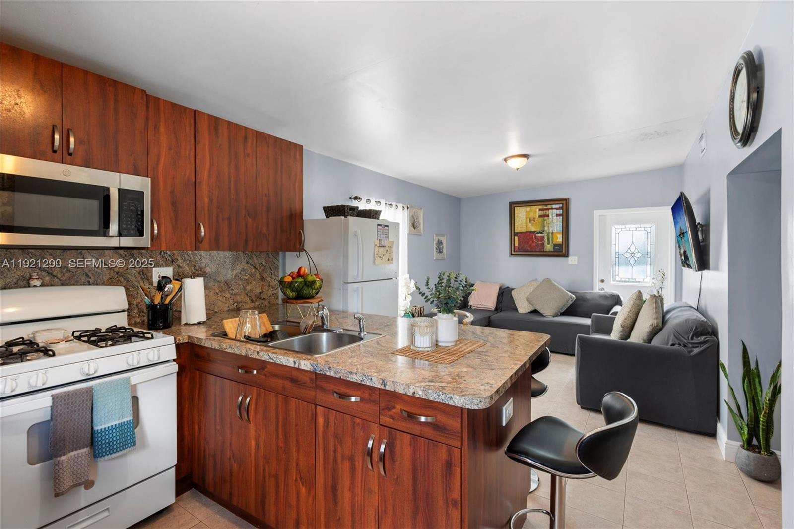 20851 Southwest 242nd Street Homestead, FL 33031 - Photo 27 of 42 a kitchen with granite countertop lots of counter top space and stainless steel appliances