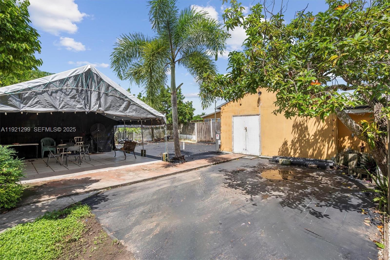 20851 Southwest 242nd Street Homestead, FL 33031 - Photo 35 of 42 a view of a house with backyard and sitting area