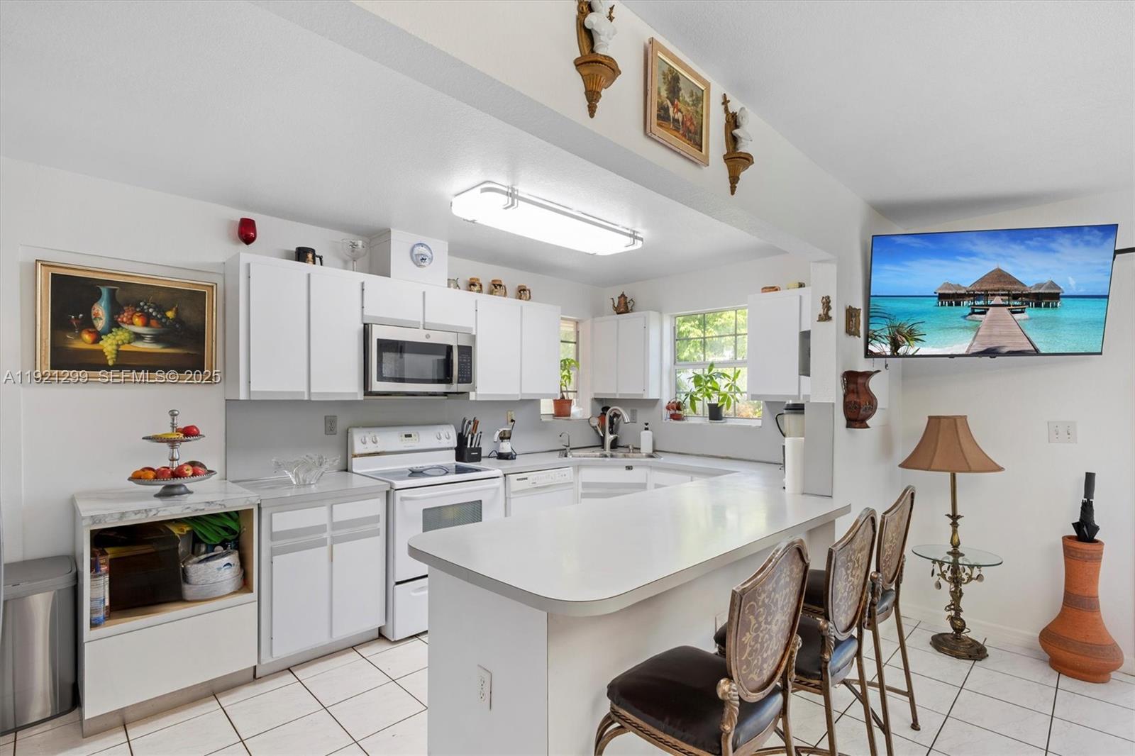 20851 Southwest 242nd Street Homestead, FL 33031 - Photo 10 of 42 a kitchen with a sink cabinets and window