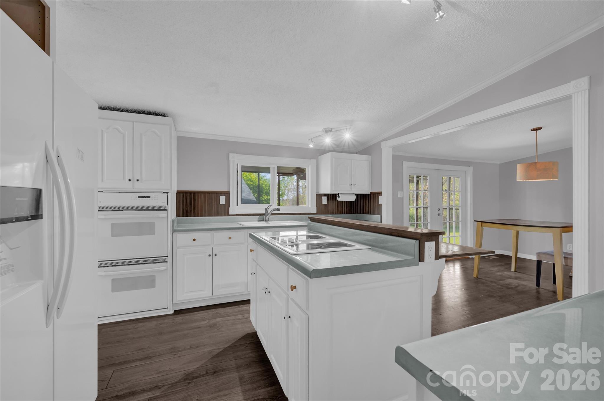 5708 Harwell Road Catawba, NC 28609 - Photo 11 of 31 a kitchen with kitchen island white cabinets and counter space