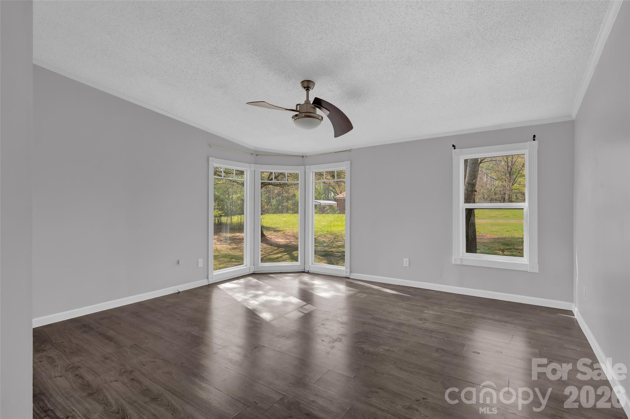 5708 Harwell Road Catawba, NC 28609 - Photo 18 of 31 a view of an empty room with a window and wooden floor