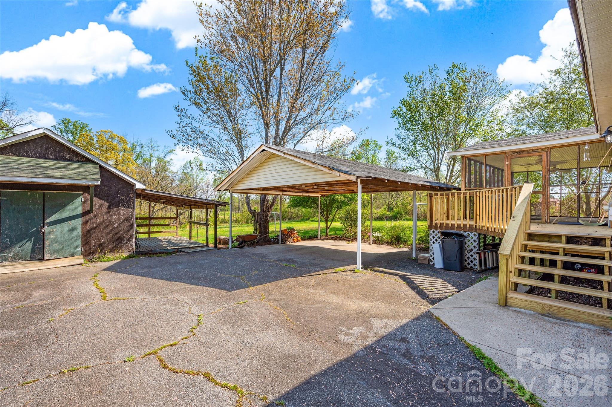 5708 Harwell Road Catawba, NC 28609 - Photo 27 of 31 a view of a patio with a table and chairs under an umbrella