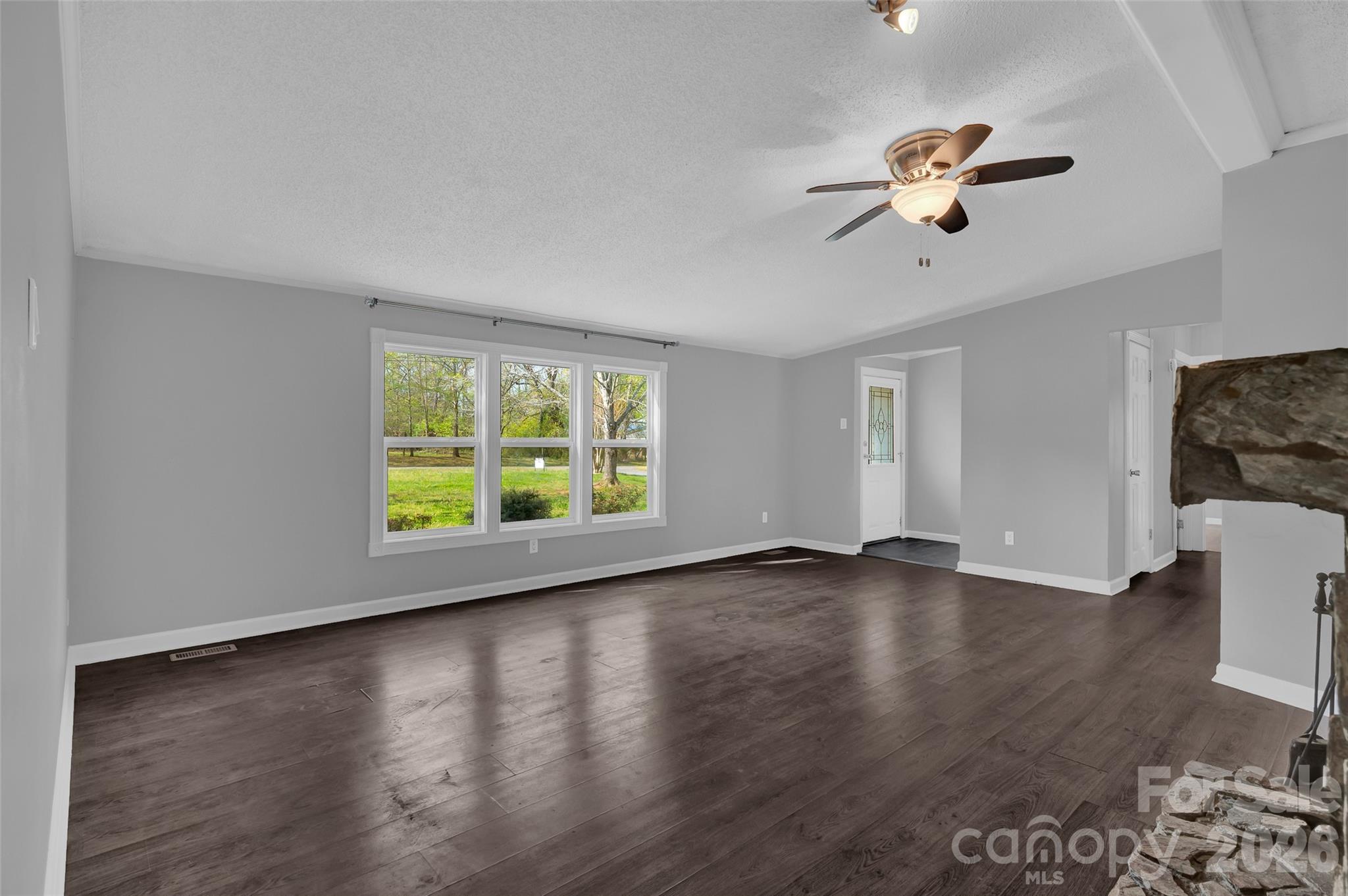5708 Harwell Road Catawba, NC 28609 - Photo 8 of 31 a view of an empty room with wooden floor and a window