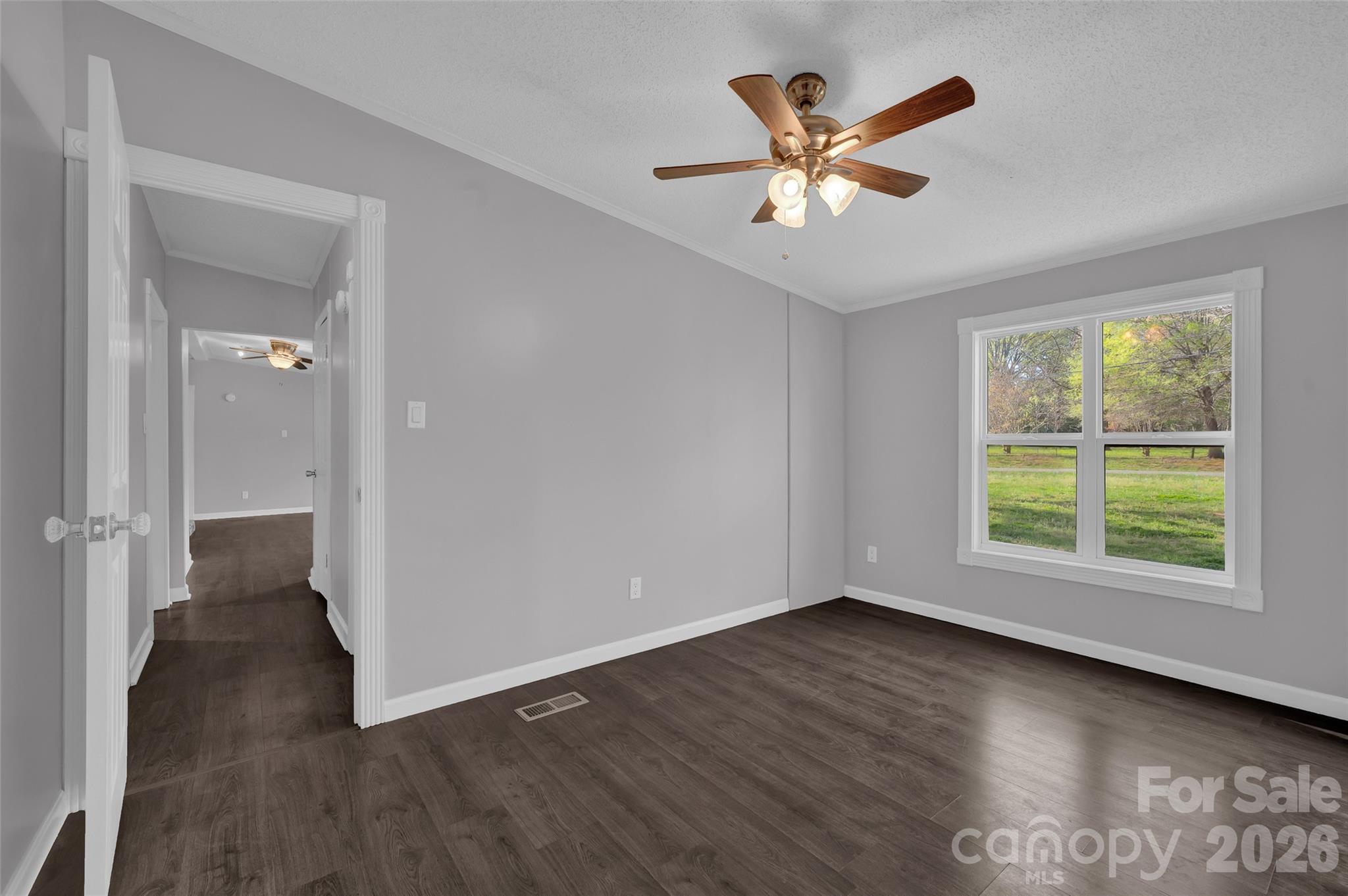 5708 Harwell Road Catawba, NC 28609 - Photo 9 of 31 a view of an empty room with wooden floor and a window