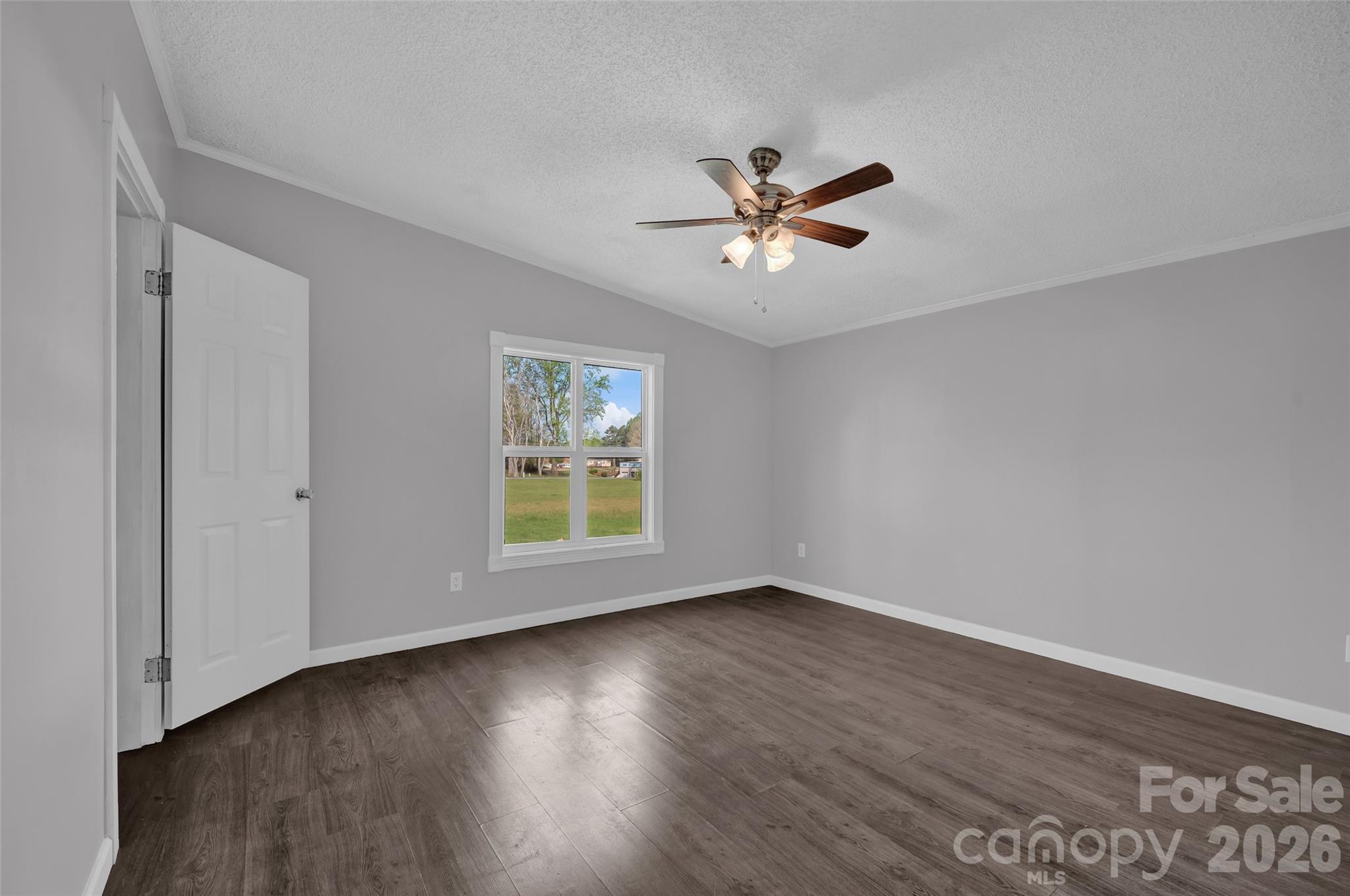 5708 Harwell Road Catawba, NC 28609 - Photo 10 of 31 a view of empty room with wooden floor and fan