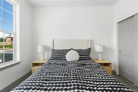 a bathroom with a black white checkered floor