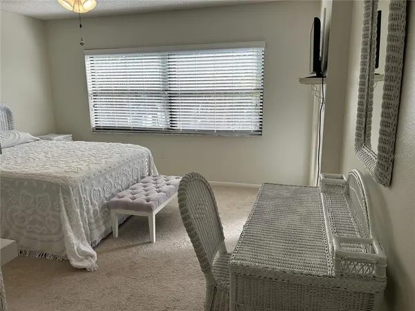 a dining room with furniture and a window