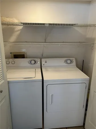 a utility room with dryer and washer
