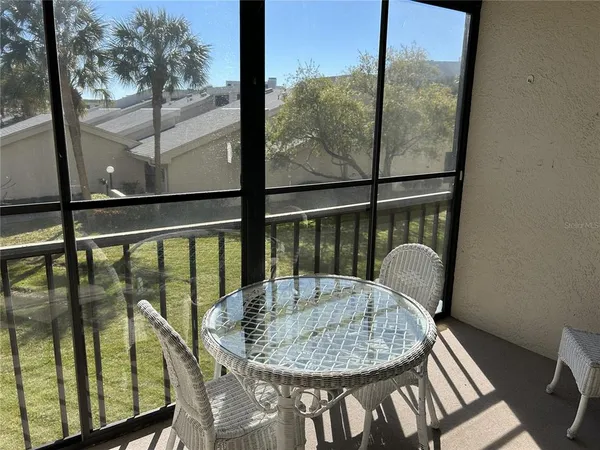 a view of a balcony from a dining room