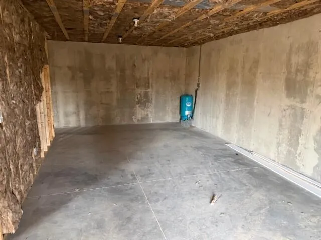 a view of a room with a wooden fence