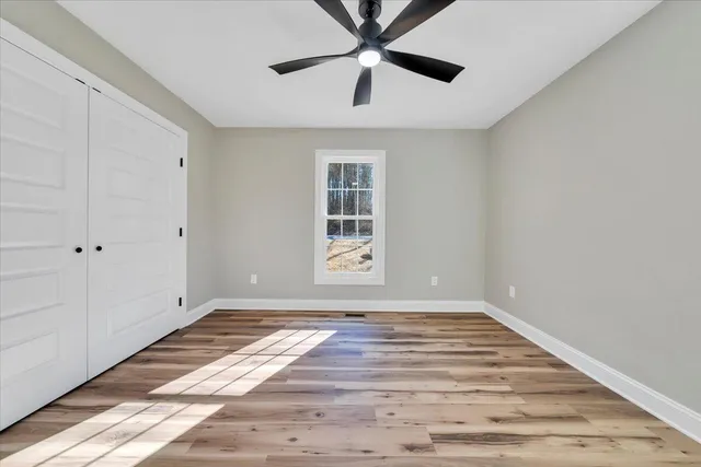 a view of balcony with wooden floor
