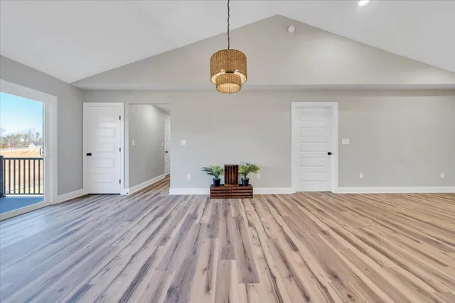 a kitchen with stainless steel appliances granite countertop a lot of counter space and wooden floors