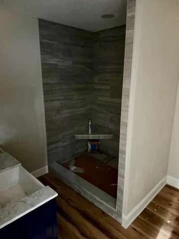 a bathroom with a sink and a mirror