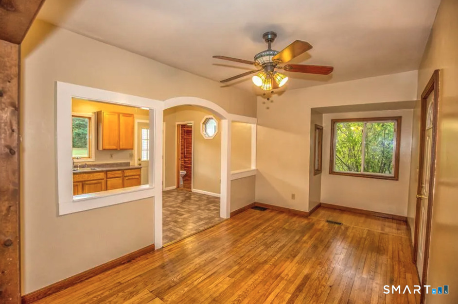 67 Middlefield Road Chester, MA 01011 - Photo 11 of 24 a view of an empty room with a window and wooden floor