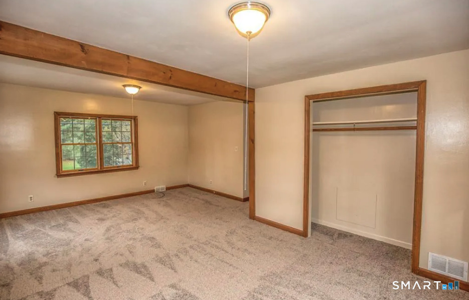 67 Middlefield Road Chester, MA 01011 - Photo 19 of 24 an empty room with windows and closet
