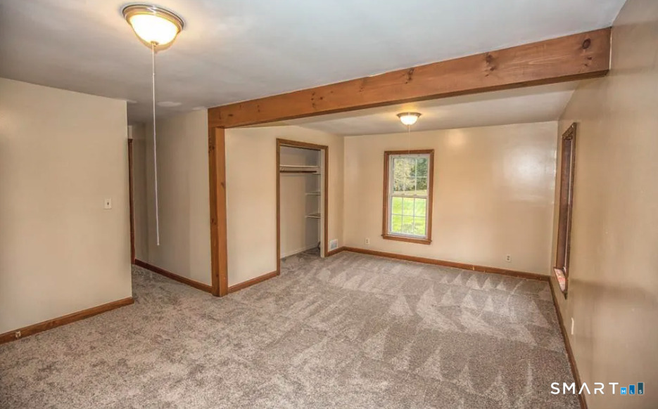 67 Middlefield Road Chester, MA 01011 - Photo 20 of 24 a view of an empty room with window and bathroom