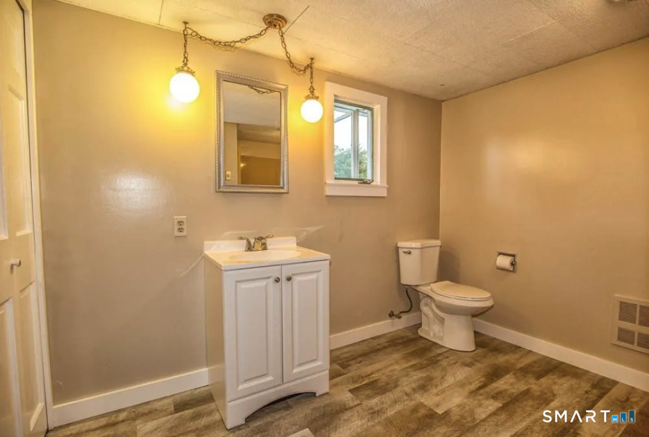 67 Middlefield Road Chester, MA 01011 - Photo 21 of 24 a bathroom with a sink and a toilet
