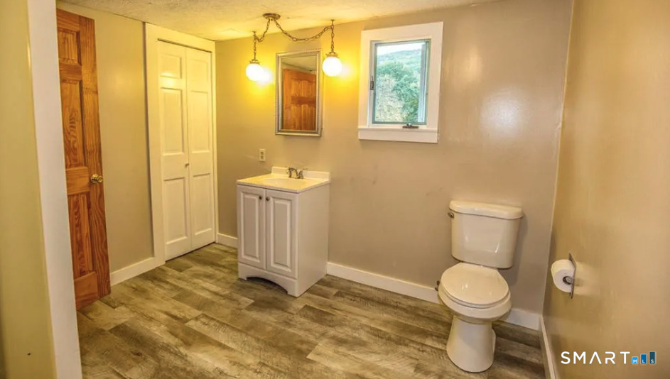67 Middlefield Road Chester, MA 01011 - Photo 22 of 24 a bathroom with a sink and a toilet