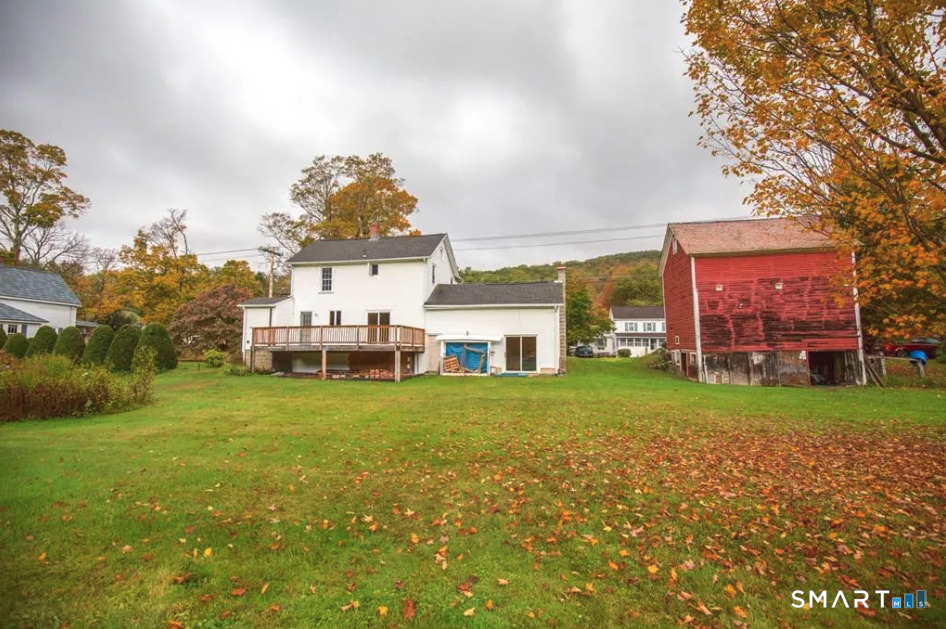 67 Middlefield Road Chester, MA 01011 - Photo 3 of 24 a front view of a house with a big yard