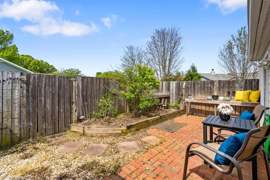 814 Guilford College Road, Unit 133 Greensboro, NC 27409 - Photo 15 of 18 patio with fruit trees
