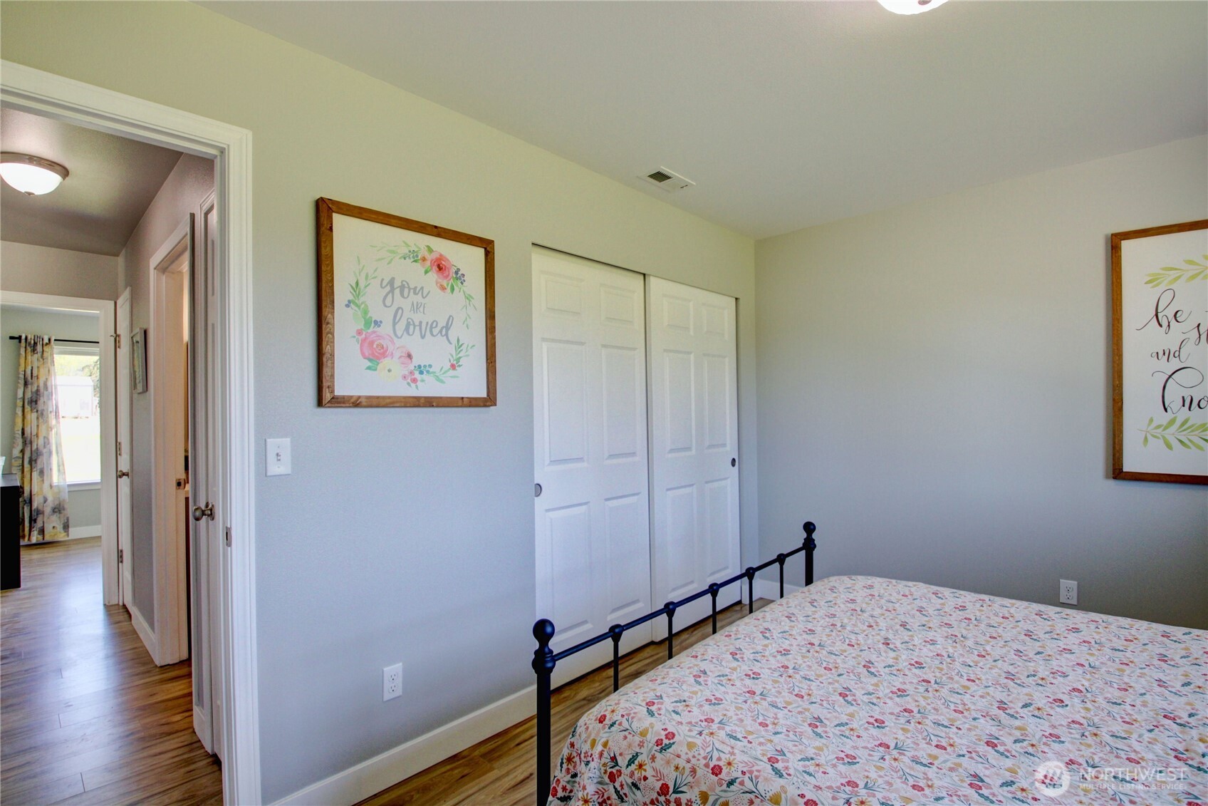 5730 Brookings Road Sedro-Woolley, WA 98284 - Photo 16 of 35 a bedroom with a bed and wooden floor