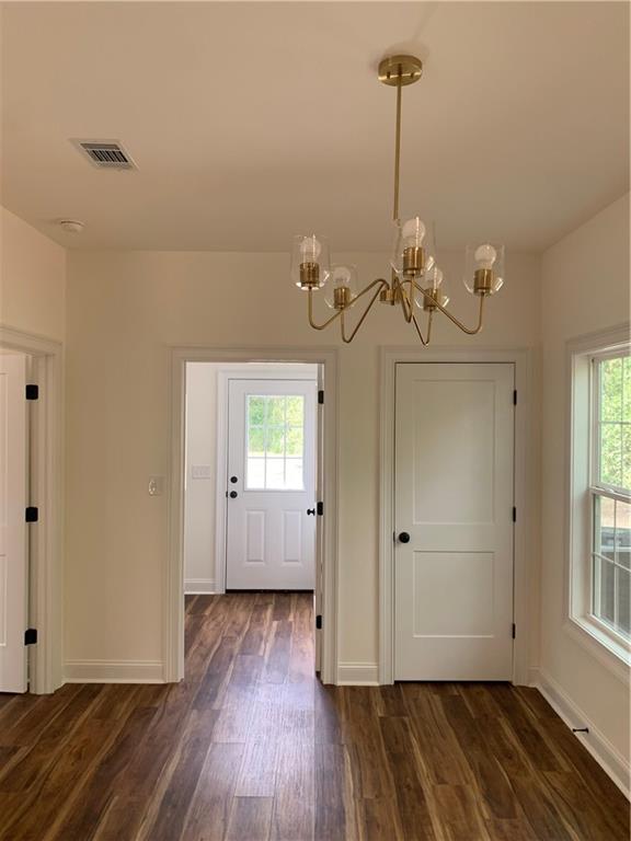 267 Saunders Street Southwest Pelham, GA 31779 - Photo 3 of 7 a view of a room with wooden floor and window