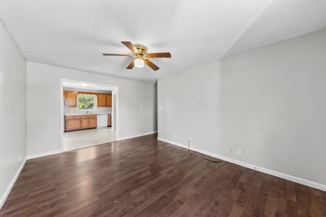 a view of room with window and ceiling fan