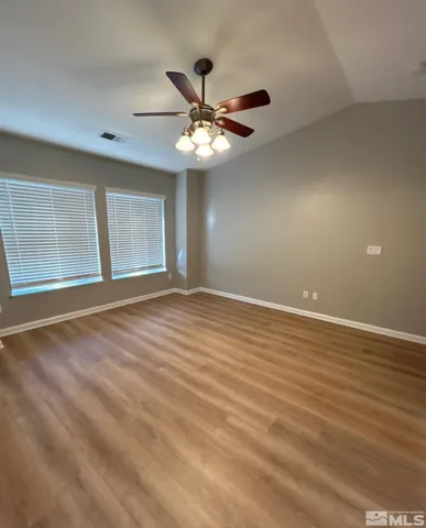 a kitchen with stainless steel appliances a sink a stove a refrigerator and cabinets