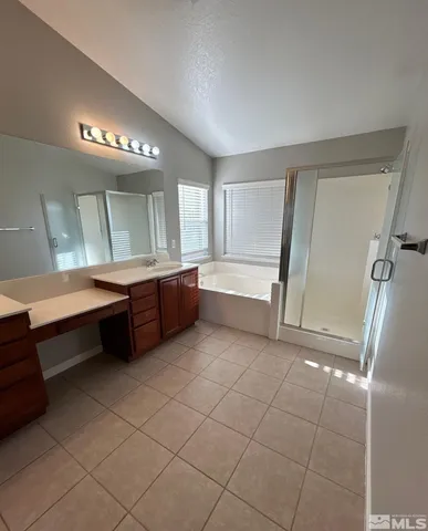 a view of a bathroom with dual sinks