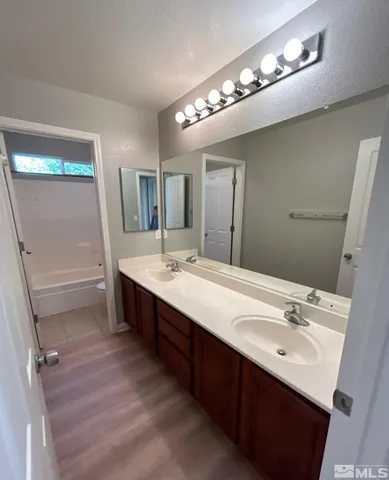a bathroom with a toilet and a bathtub