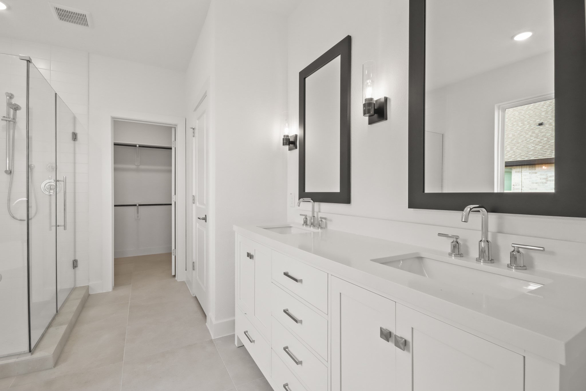 2810 Clapbread Lane Rosenberg, TX 77471 - Photo 9 of 39 a bathroom with a double vanity sink and mirror