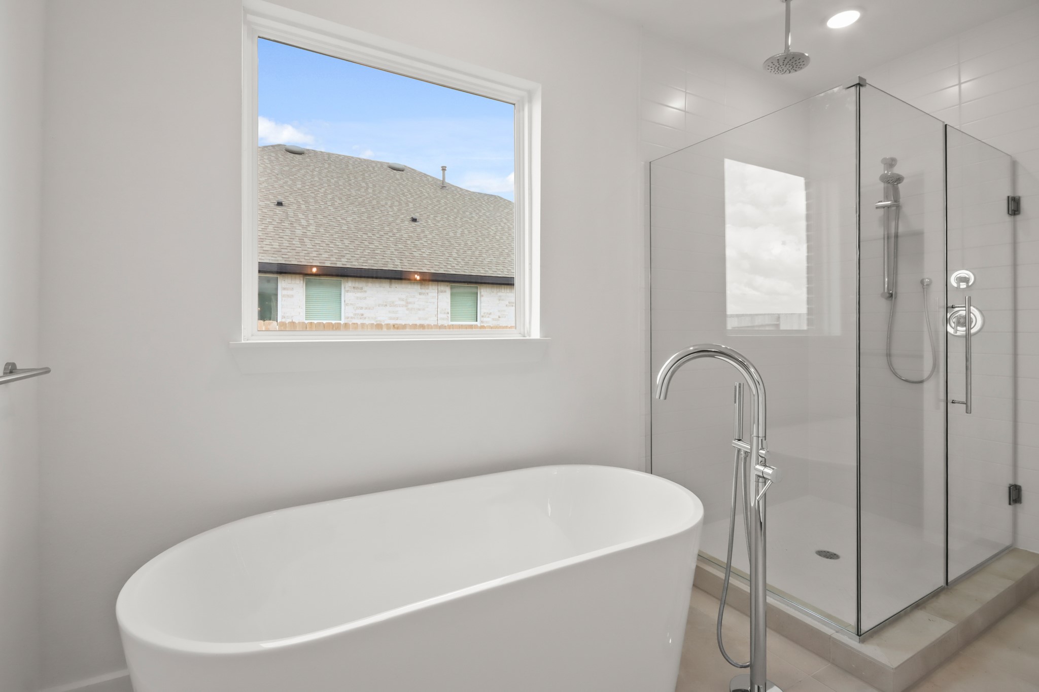 2810 Clapbread Lane Rosenberg, TX 77471 - Photo 10 of 39 a white bath tub sitting next to a bathroom sink