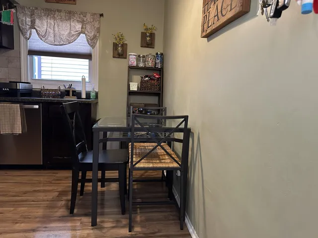 a dining room with furniture and window