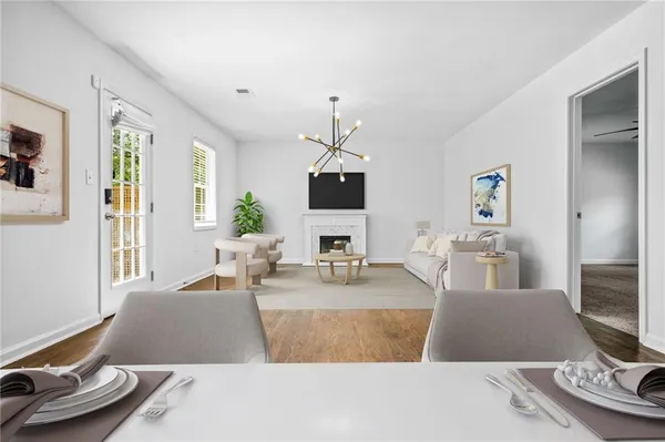 a living room with furniture and flat screen tv
