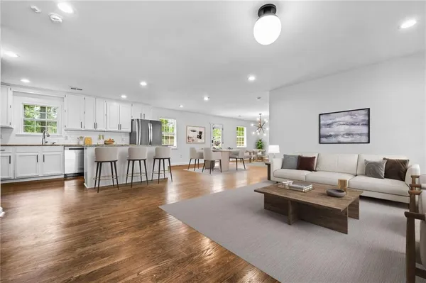 a living room with furniture and a table